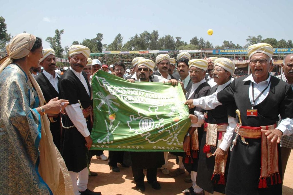 Members releasing the banner of a hockey tournament.